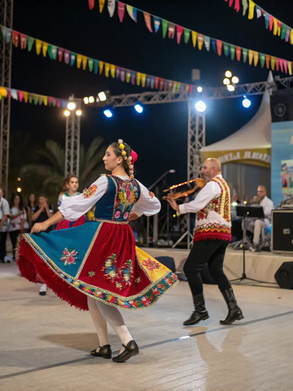 A lively scene from a CJSC-organized cultural festival, featuring traditional music, dance, and food, celebrating the diversity of Compregnac.